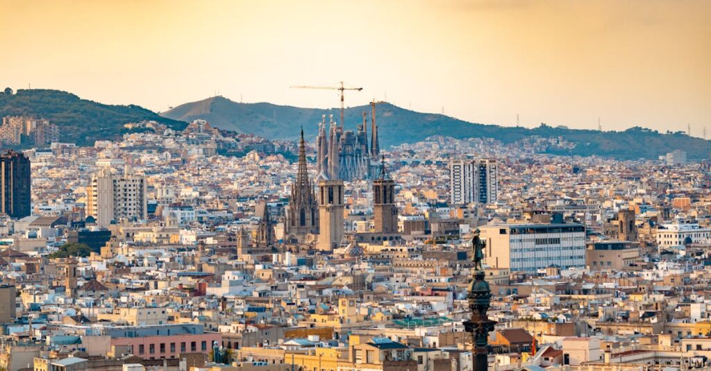 A breathtaking aerial view of Barcelona featuring the iconic Sagrada Familia at sunset.